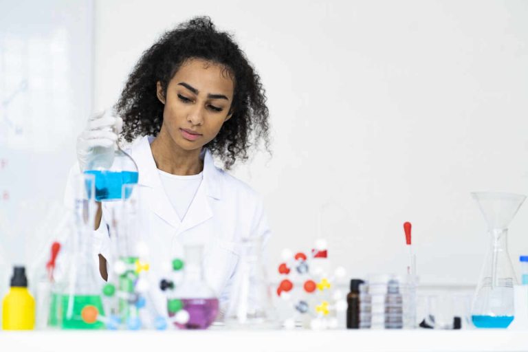 Young mixed race chemist working in a chemistry lab