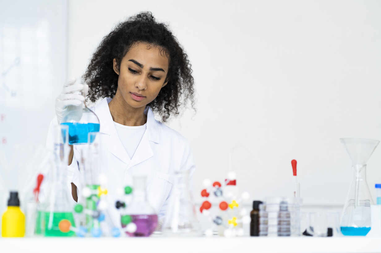 Young mixed race chemist working in a chemistry lab